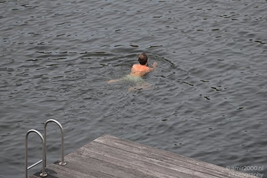 Swimmer_In_Canal_Amsterdam_Netherlands_People_Creative_Collection_Photography_Canon_EOS_R5_Mark_II_2026_001.JPG