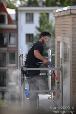 Worker_Using_Pressure_Washer_Amsterdam_Netherlands_People_Creative_Collection_Photography_Canon_EOS_R5_Mark_II_2026_001.JPG
