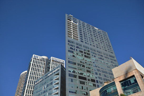 A cluster of modern high rise buildings under a clear blue sky in Tel Aviv Jaffa, Israel. - image from year 2026 #003