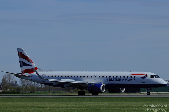A British Airways Embraer aircraft on an airport runway with clear skies and grassy surroundings - image from year 2026 #004