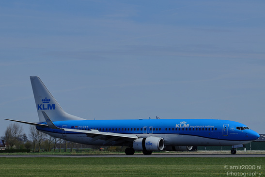 A KLM Royal Dutch Airlines aircraft on an airport runway under clear skies in Schiphol, - image from year 2026 #001