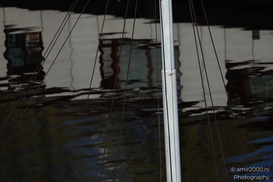Boat Rigging Reflections photographed with shallow depth of field and gentle natural tones. - image from year 2026 #001