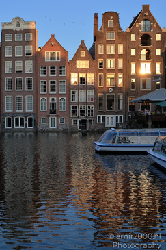 Damrak_Canal_Houses_At_Golden_Hour_Amsterdam_Netherlands_Cityscape_Photography_Canon_EOS_R5_Mark_II_2026_002.JPG