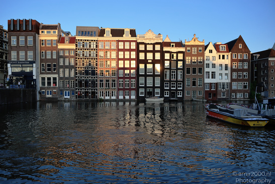 Damrak_Canal_Houses_At_Golden_Hour_Amsterdam_Netherlands_Cityscape_Photography_Canon_EOS_R5_Mark_II_2026_006.JPG