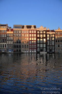 Damrak_Canal_Houses_At_Golden_Hour_Amsterdam_Netherlands_Cityscape_Photography_Canon_EOS_R5_Mark_II_2026_007.JPG