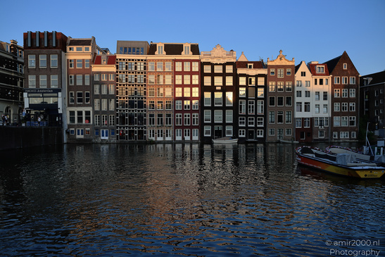 Damrak_Canal_Houses_At_Golden_Hour_Amsterdam_Netherlands_Cityscape_Photography_Canon_EOS_R5_Mark_II_2026_008.JPG