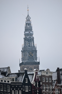 Dark_With_Historic_Clock_Tower_And_Snowcovered_Amsterdam_Netherlands_Cityscape_Photography_Canon_EOS_R5_Mark_II_2026_001.JPG