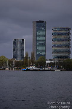 Harbor with tall buildings and a dark sky. - image from year 2026 #002