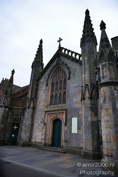 Scottish City Inverness a Gothic style church with intricate stone carvings and a blue door. - image from year 2026 #032