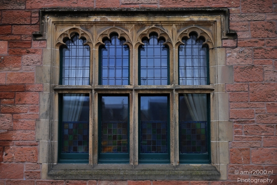 Scottish City Inverness a historic window with intricate stone frames and colorful stained glass - image from year 2026 #034