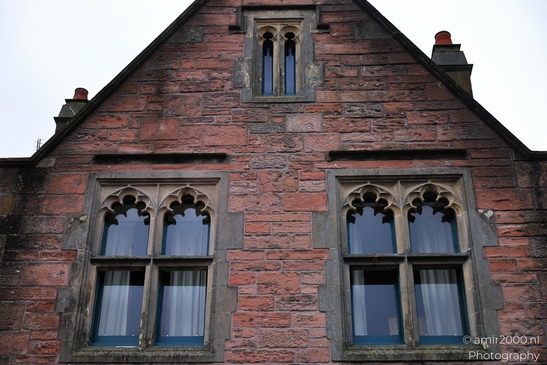 Scottish City Inverness a historic building with ornate windows and a red brick facade. - image from year 2026 #035