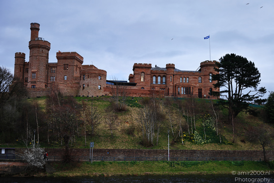 Scottish City Inverness a historic castle with red brick walls and towers overlooks a grassy - image from year 2026 #038