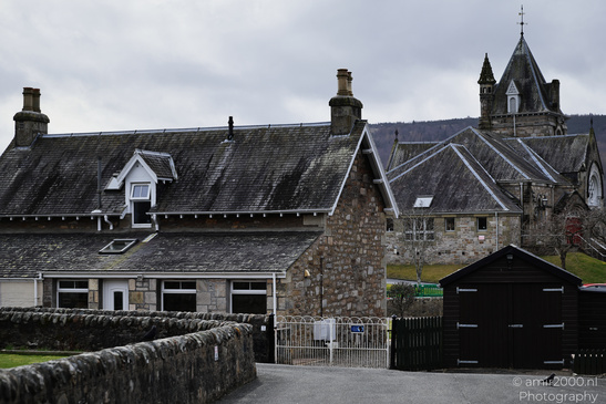 Town Pitlochry a quaint village scene with a stone building and a church. - image from year 2026 #009