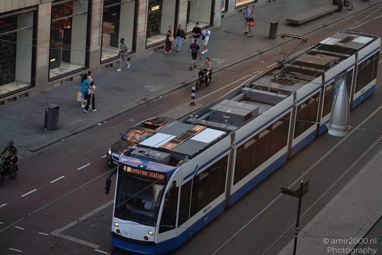 Tram_At_Damrak_Amsterdam_Netherlands_Cityscape_Photography_Canon_EOS_R5_Mark_II_2026_001.JPG