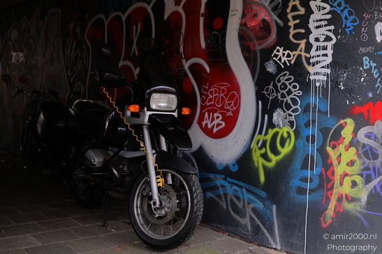 Urban_Artistry_Graffitiadorned_Tunnel_With_Motorcycles_Amsterdam_Netherlands_Cityscape_Photography_Canon_EOS_R5_Mark_II_2026_002.JPG