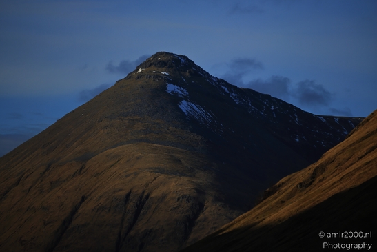 Mountain peak with patches of snow and clear sky in the background in Scotland United Kingdom. - image from year 2026 #014