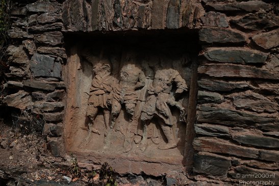 Burg Eltz Medieval Castle a stone relief depicting three figures in a niche within a stone wall - image from year 2026 #003