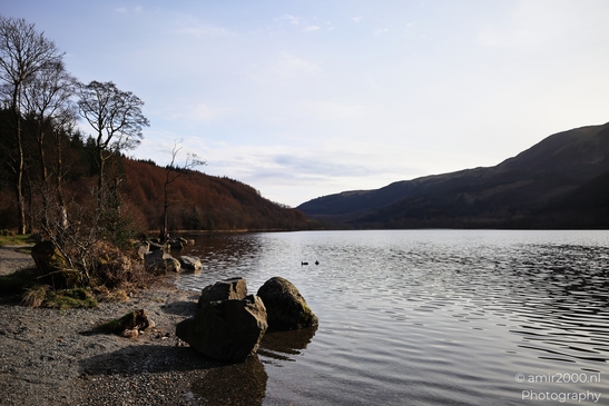 Loch Lomond Lowlands Highlands a lake surrounded by trees and mountains under clear sky. - image from year 2026 #005