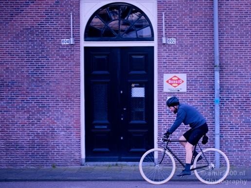 A_cyclist_in_th_e_city_Amsterdam_Netherlands_Canon_EOS_5D_Mark_IV.JPG