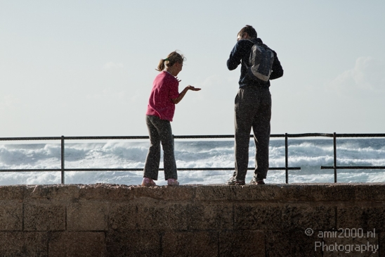 A_dad_and_a_daughter_enjoy_the_splash_of_the_waves_Caesarea_Israel_Canon_EOS_7D.JPG