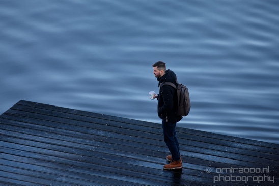 A_guy_with_coffee_on_the_wooden_dock_afte_th_rain_Amsterdam_Netherlands_Canon_EOS_5D_Mark_IV.JPG