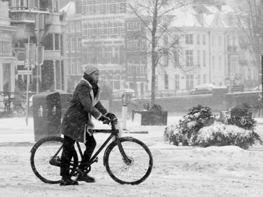 A_man_walking_with_his_bicycle_during_snow_storm_Amsterdam_Netherlands_Canon_EOS_5D_Mark_IV.JPG