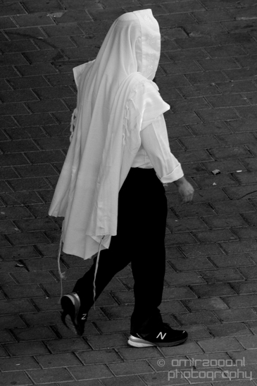 A_religious_man_walking_to_the_synagogue_during_jewish_holiday_Tel_Aviv-jaffa_Israel_Canon_EOS_5D_Mark_IV.JPG