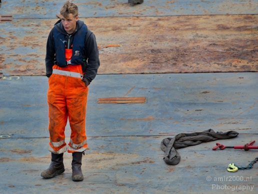 Dutch_worker_whisteling_wearing_orange_jumpsuit_Amsterdam_Netherlands_Canon_EOS_5D_Mark_IV.JPG