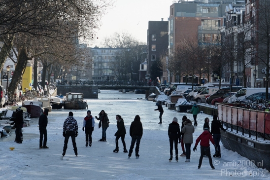 People_on_the_icy_canal_playing_and_ice_skating_Amsterdam_Netherlands_Canon_EOS_7D.JPG