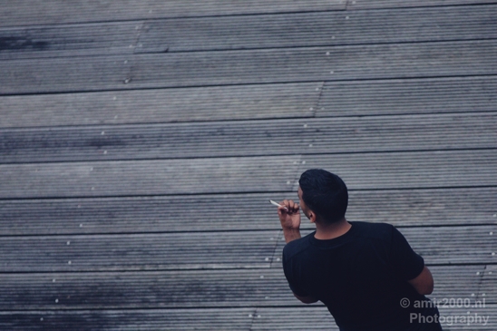 Smoking_to_chill_on_the_wooden_dock_Amsterdam_Netherlands_Canon_EOS_5D_Mark_IV.JPG