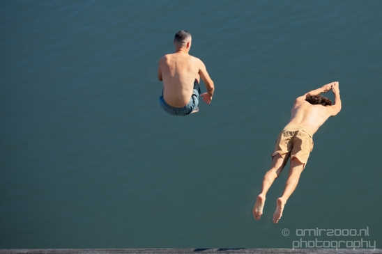 Two_guys_from_the_back_jumping_to_the_canal_Amsterdam_Netherlands_Canon_EOS_5D_Mark_IV.JPG