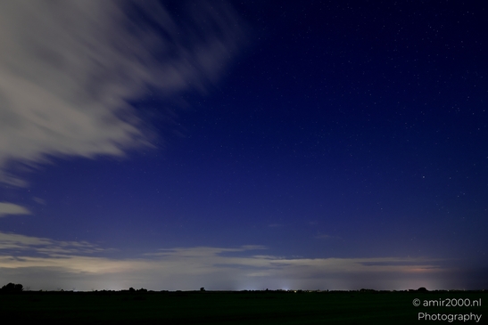 A stormy night sky in Noord-Holland, Netherlands, with clouds and stars visible in Noord-Holland - image from year 2025 #022