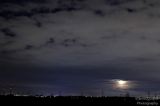 A stormy night sky over Noord-Holland in the Netherlands, with clouds and a full moon - image from year 2025 #036